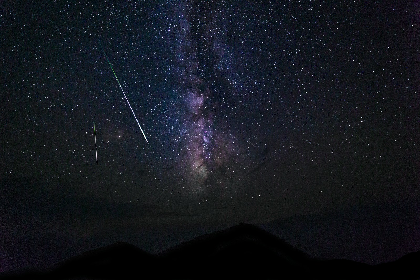 falling stars and milky way galaxy at night